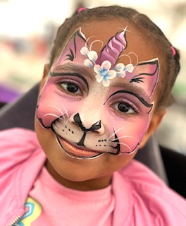 kittycorn face painting on a girl